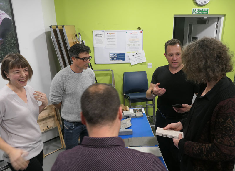 group of garden designers examining samples of landscape materials