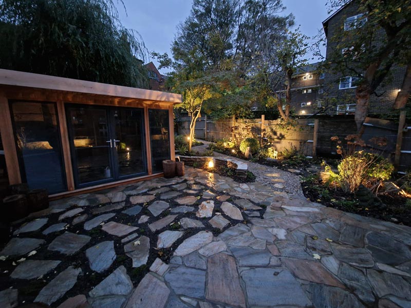 craxy paving patio built using paddlestones pictured at dusk