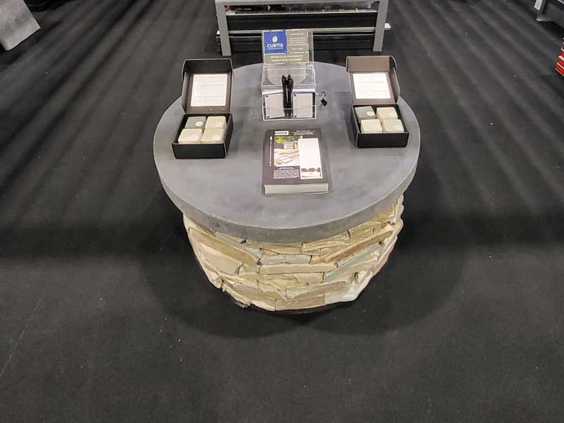coffee table display unit for a trade show built using yellow paddlestones and bespoke stone from Arbour Landscape Solutions