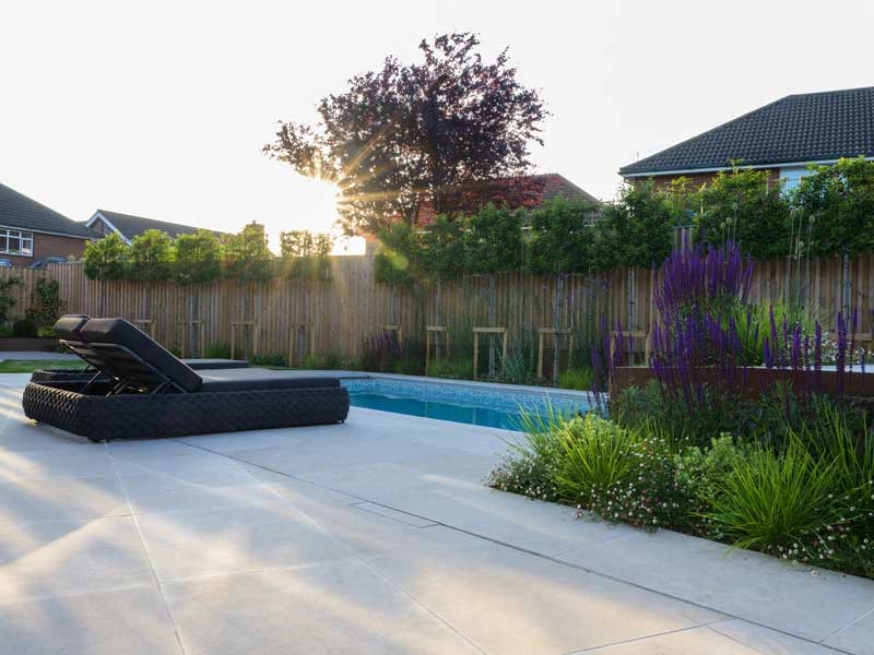 pre-sealed limestone paving around a pool