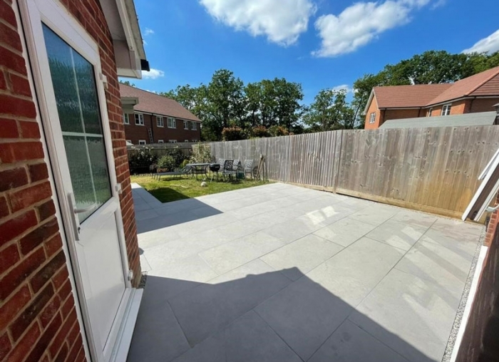 Newbuild garden in Surrey with grey porcelain paving