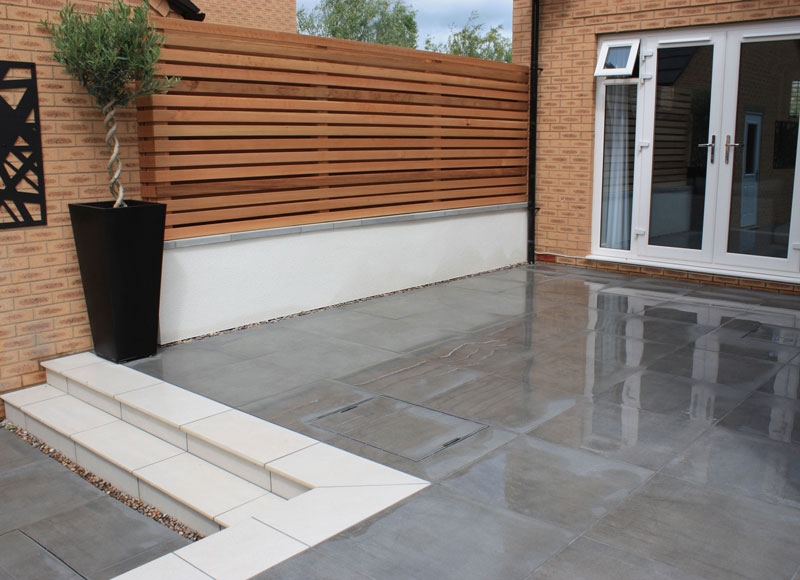 grey porcelain paving edged with white available from Arbour Landscape Solutions
