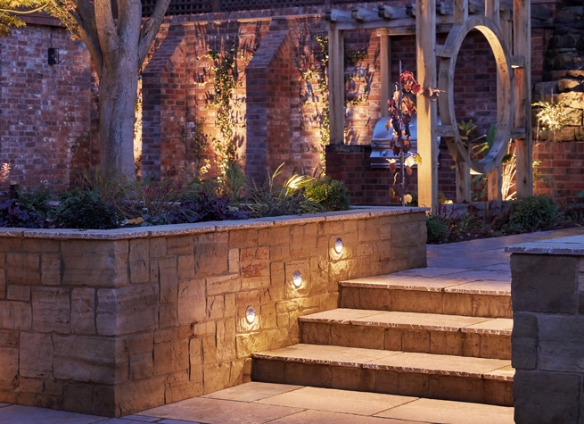 beautifully lit steps in garden patio area