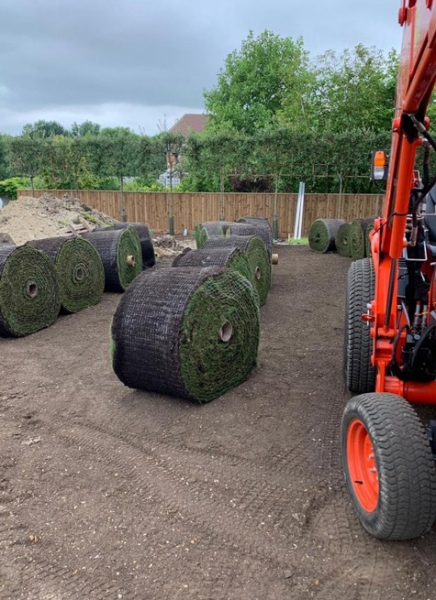 big roll turf being laid in a large buckinghamshire garden