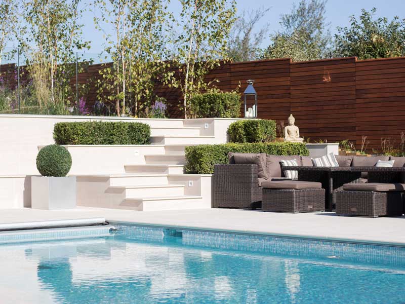 contemporary swimming pool garden with white porcelain paving