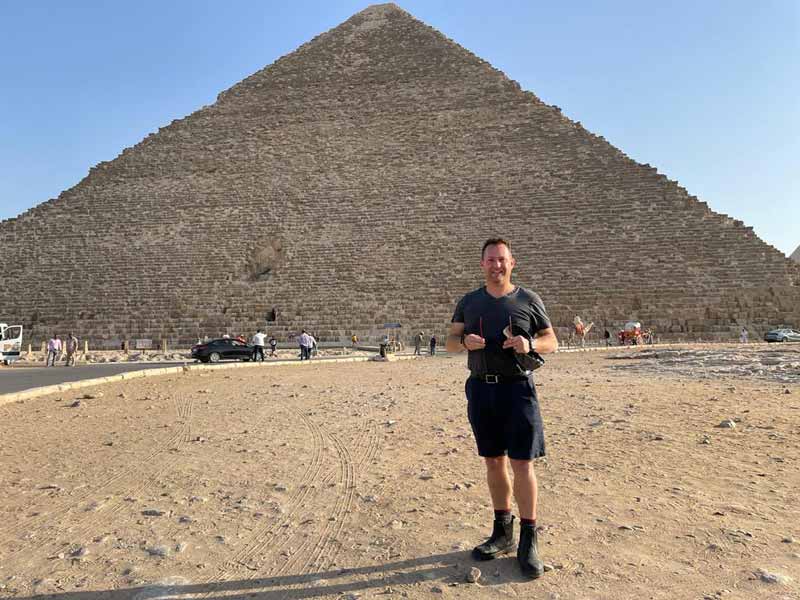 Richard Bickler of Arbour Landscape Solutions standing in front of an Egyptian pyramid