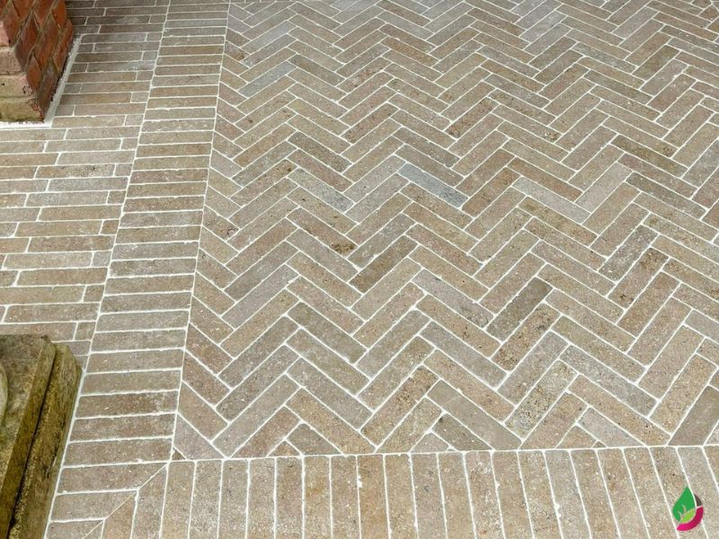 external entranceway paved with sinai pearl beige egyptian limestone slim setts arranged in a herringbone pattern