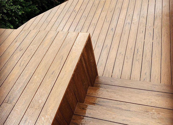 beautiful natural timber deck with steps and changes of level skillfully executed