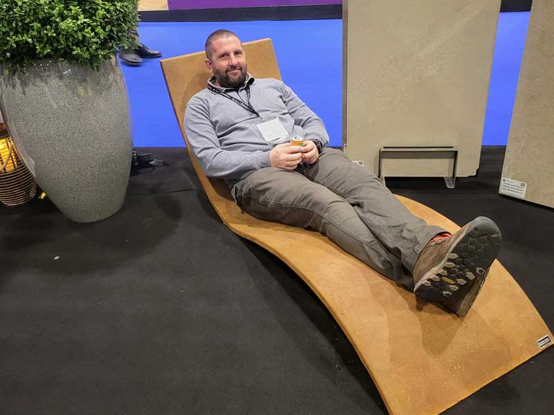 landscaper on a lounger enjoying a soft drink