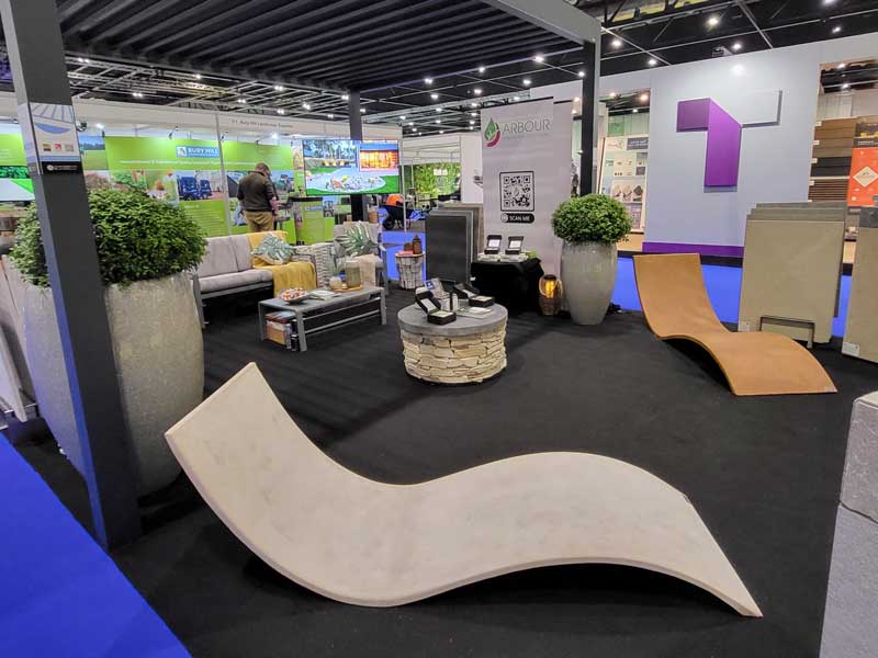 lifestyle show stand with pergola and stylish seating