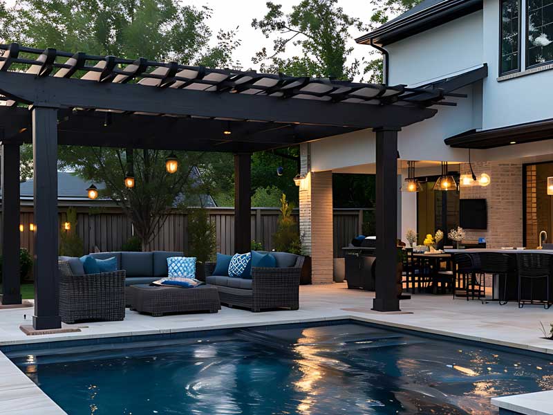 beautiful garden swimming pool with bespoke pergola and adjacent verandah with luxury furniture