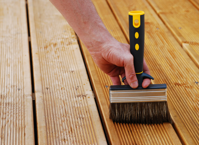 timber treatment being applied