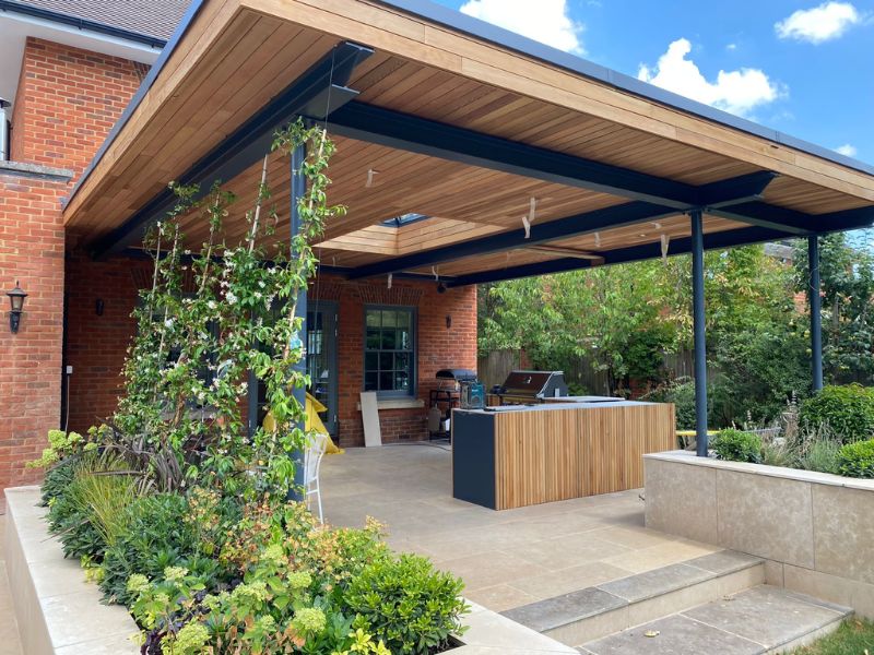 modern verandah brought to life by a wall of climbing plants