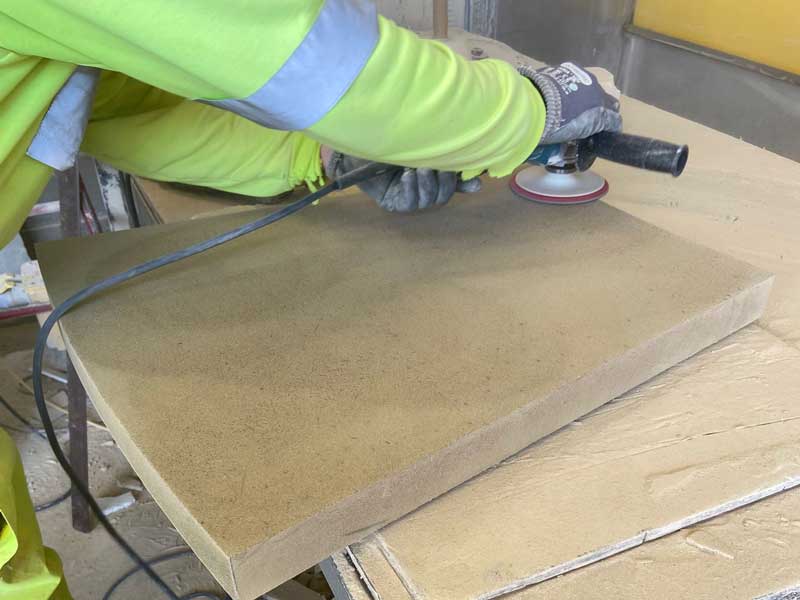 bespoke shaped paver being checked and polished before despatch